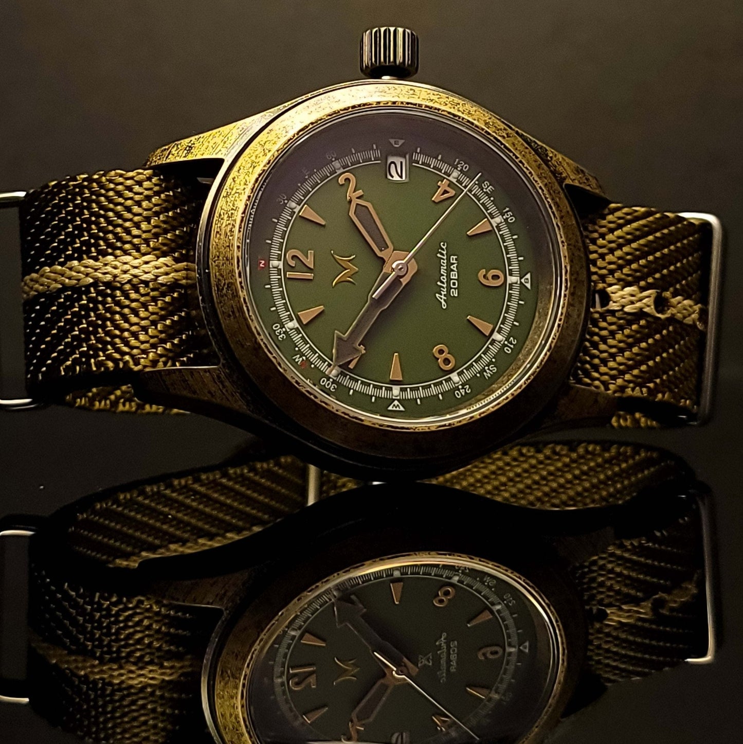 Custom Handcrafted Seiko Mod Vintage Alpinist sitting on a table is one of the best seiko mods to own
