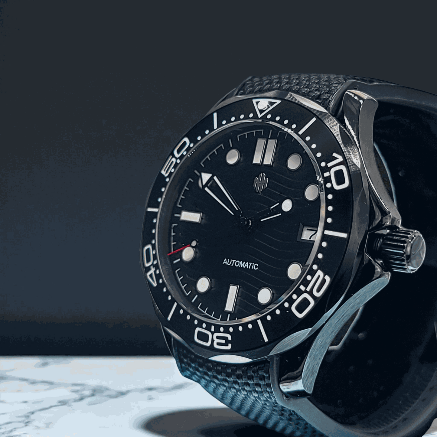 A Seiko Mod Omega Seamaster with a Black Dial on a white concrete counter top