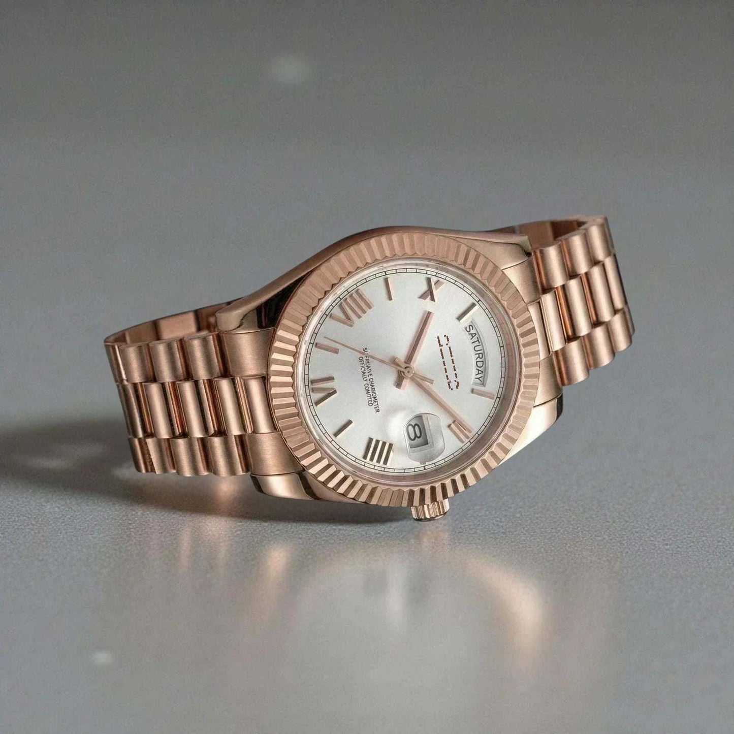 MODTIME rose gold automatic watch with a white dial, Roman numerals, and a fluted bezel on a stainless steel bracelet