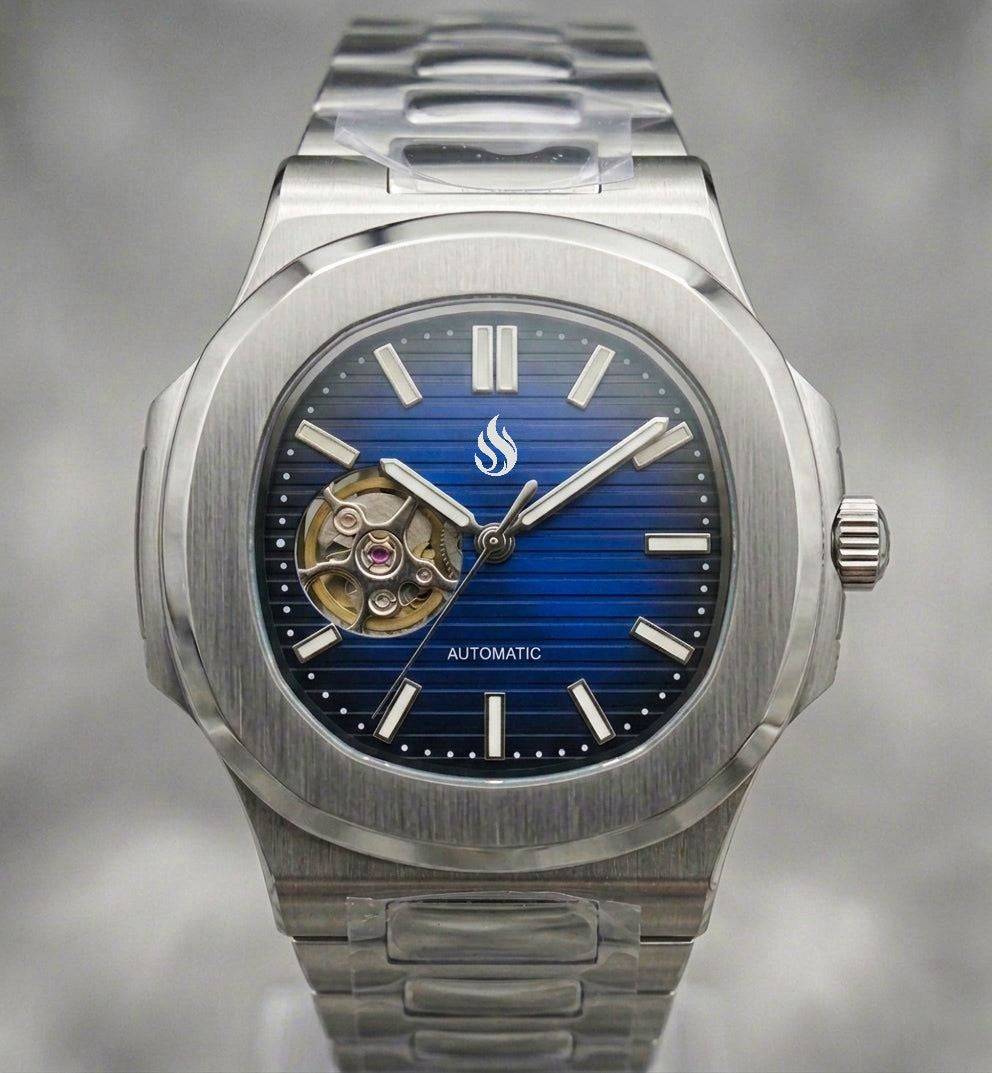 MODTIME SeikNaut open-heart watch with a dark blue horizontal-striped dial and stainless steel bracelet.