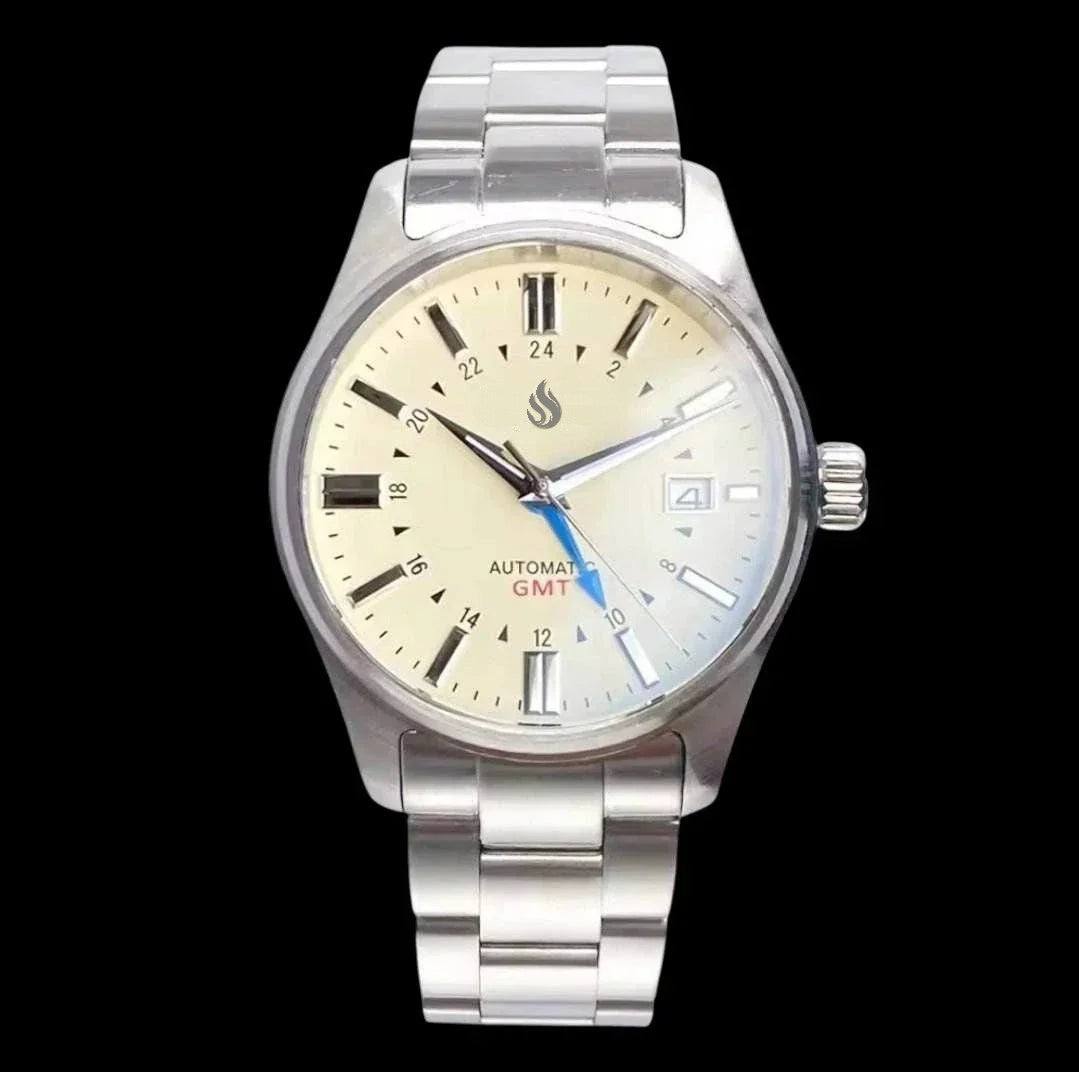 MODTIME custom GMT automatic pilot watch with a cream dial, stainless steel case, and blue GMT hand.