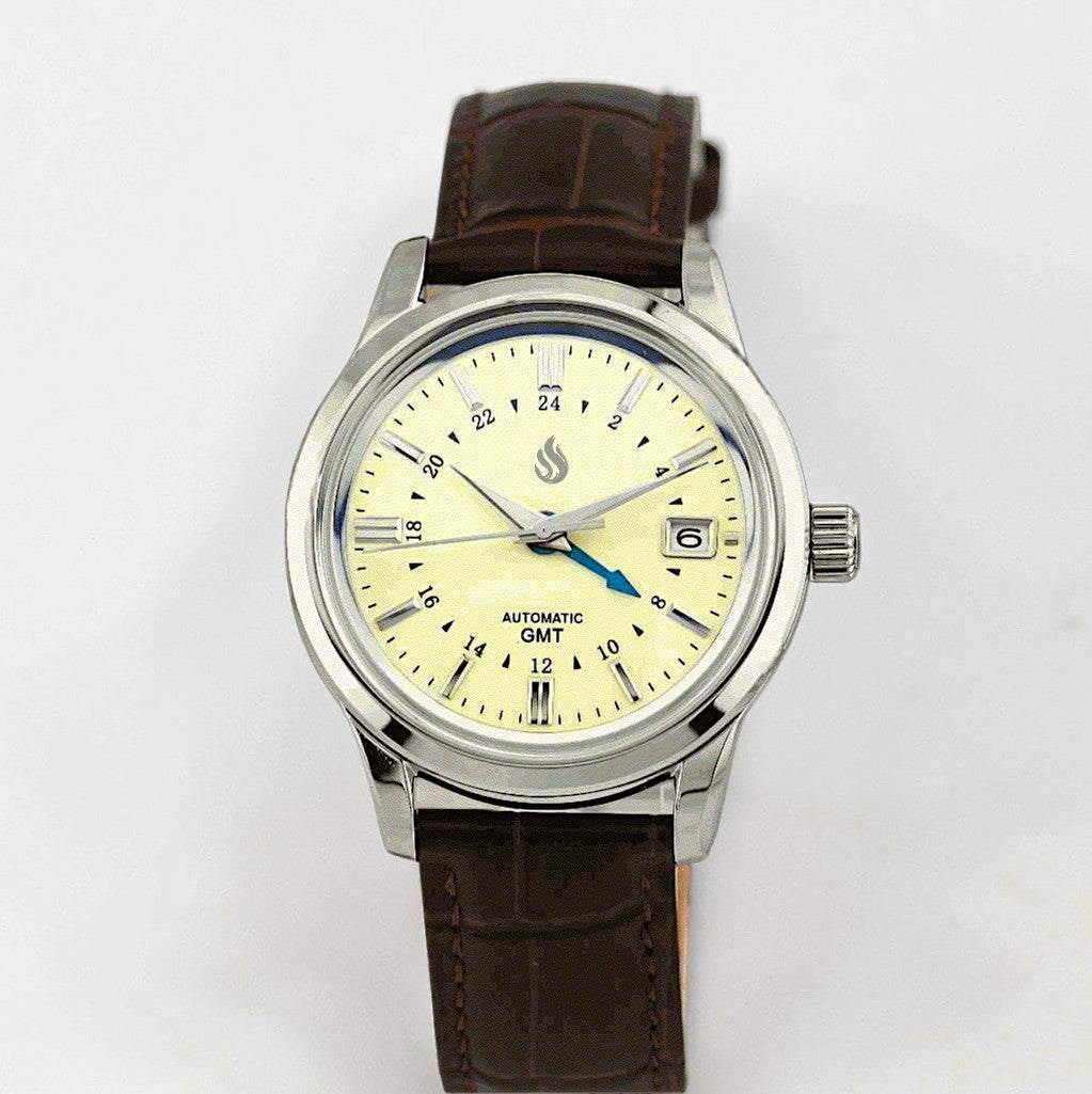 MODTIME GMT automatic pilot watch with a cream dial, blue GMT hand, and brown leather strap on a white background.
