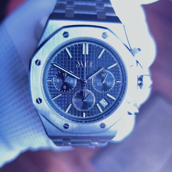 A man showcasing the Modded Seiko Royal Oak with a blue dial, a unique piece from the Seiko Oak Chrono Series, a fusion of classic and modern styles.