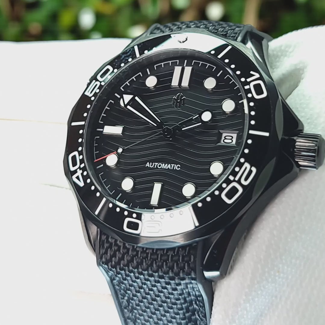 A video of Seiko Mod Omega Seamaster with a Black Dial being held in a white gloved hand 