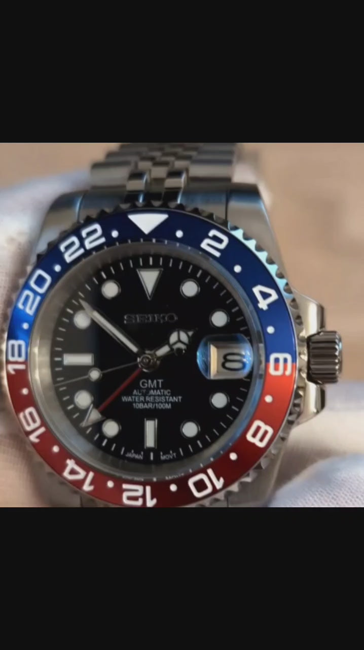 A Close up Viseo of a Blue Red Pepsi bezel GMT Seiko Mod 