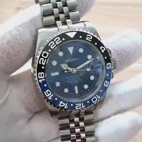 A close up video of a Blue Black Batman Submariner 