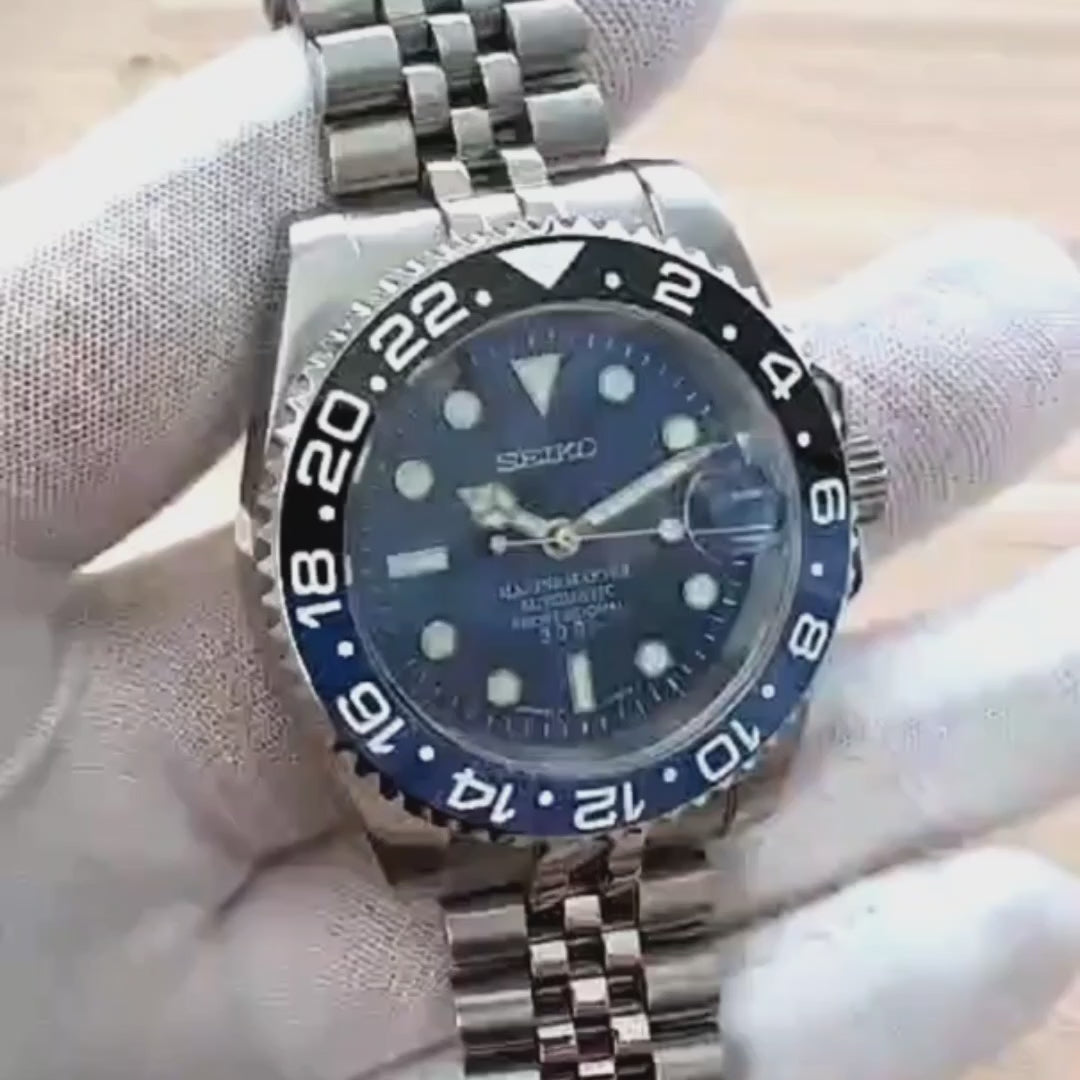 A close up video of a Blue Black Batman Submariner 
