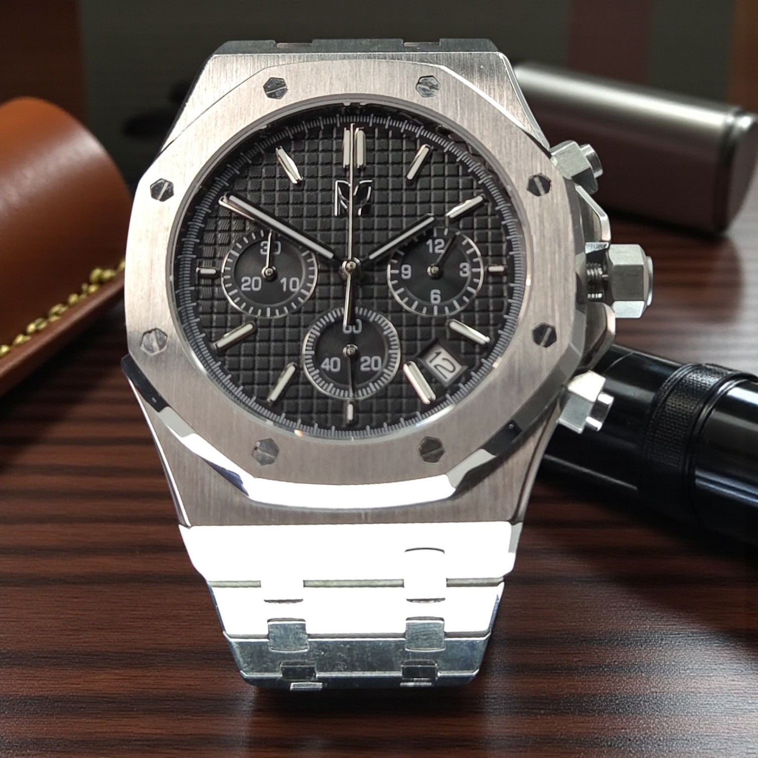 This a video of a handcrafted Custom Seiko Mod Royal oak with a custom black dial and silver case 