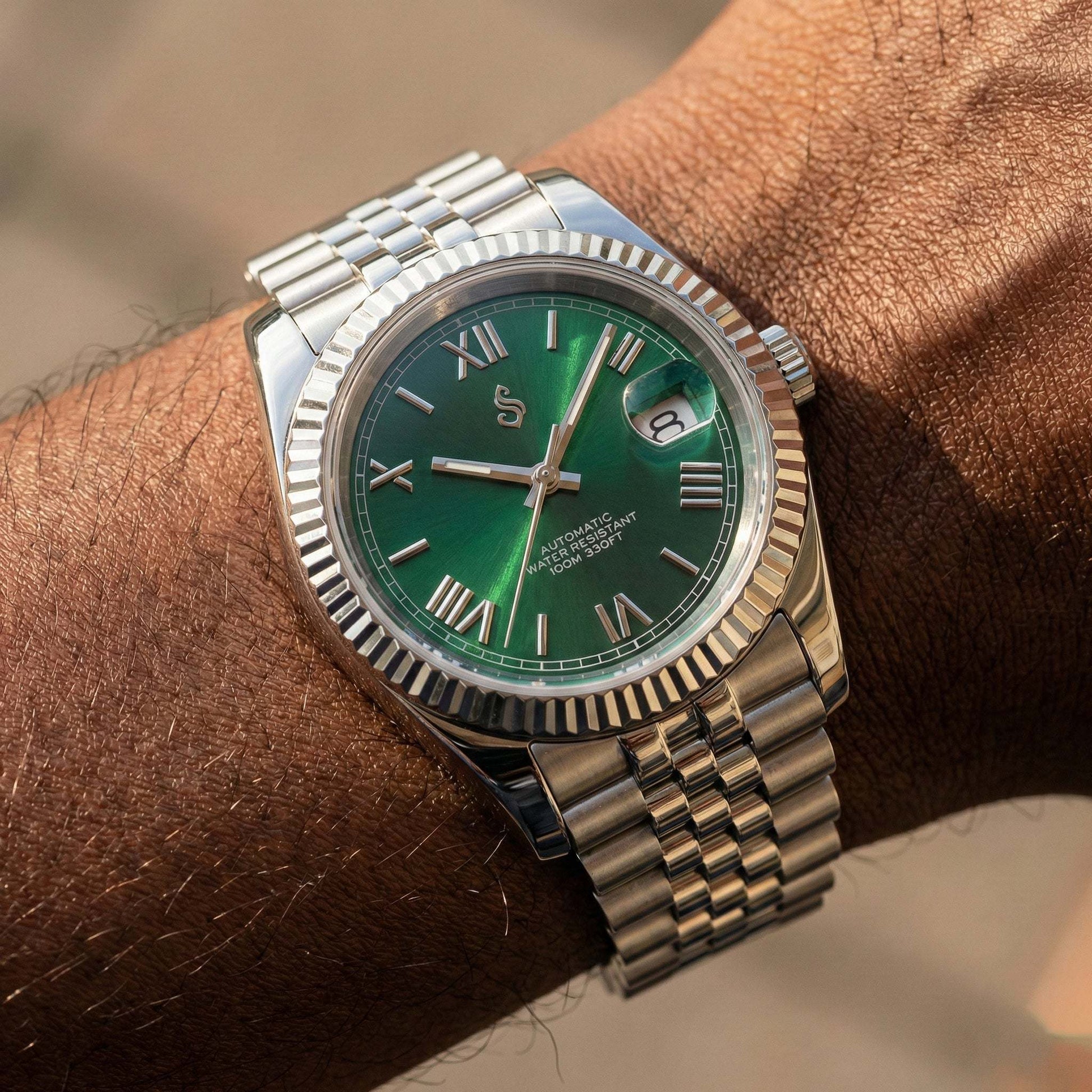 Seiko Mod with green dial, Roman numerals, date window, and sapphire crystal by Modtime Creations