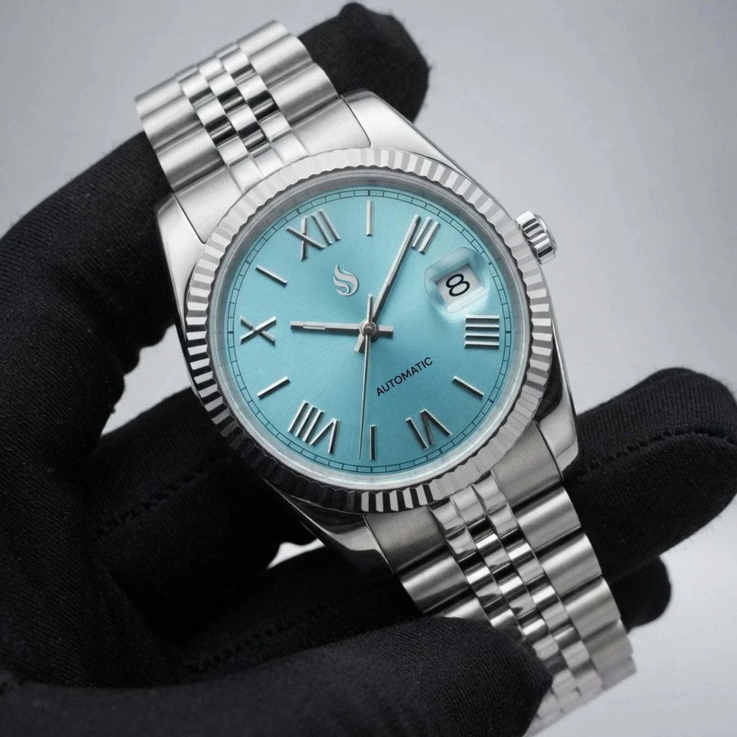 Seiko Mod Watch Datejust Tiffany Blue Dial with Roman Numeral Indices in a silver case and bracelet built by Modtime Creations 