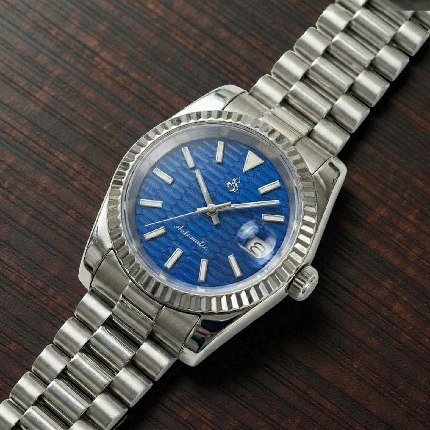 SeikJust date window watch with blue ripple motif dial by Modtime Creations featuring NH35 automatic movement and sapphire crystal