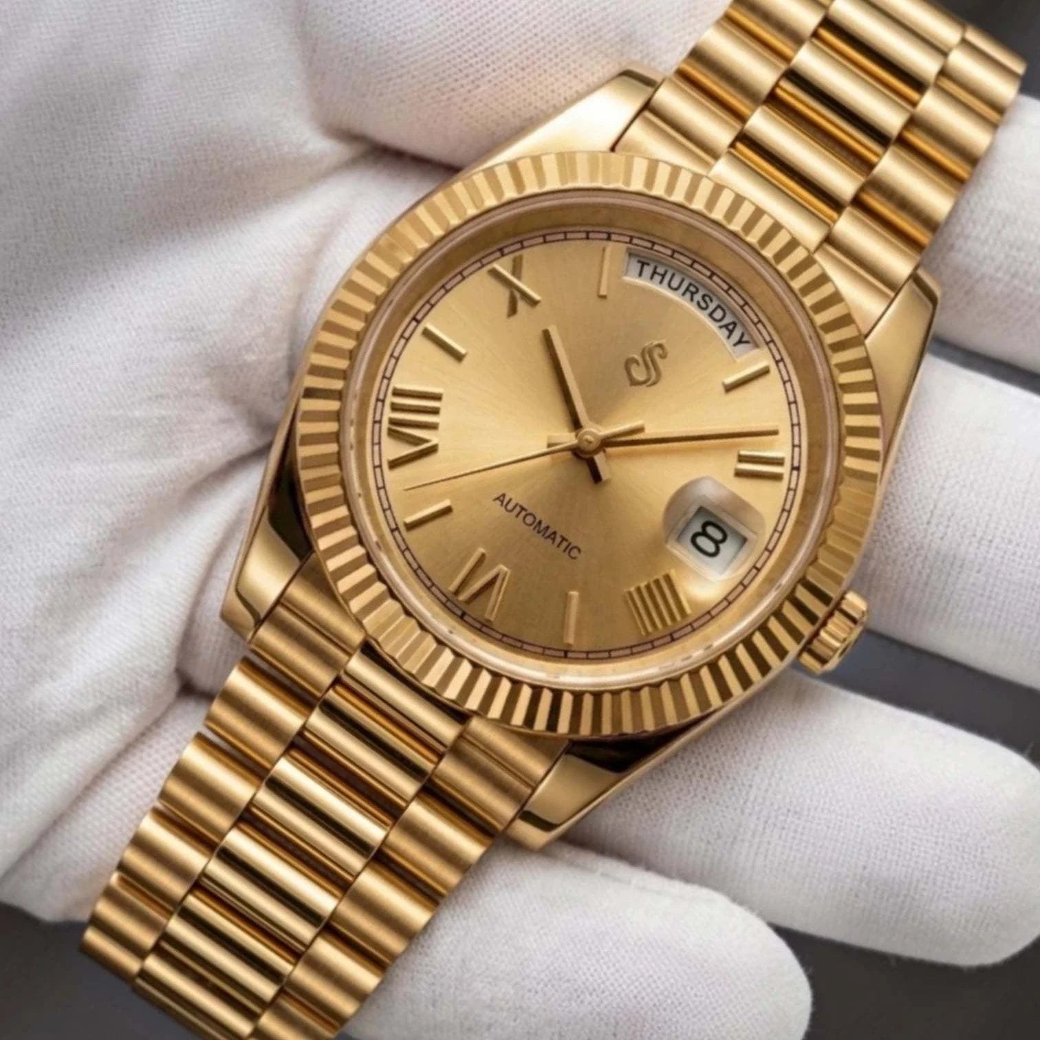 Seiko  Mod Daydate Homage watch with gold Roman numerals, day and date display, and sapphire crystal dial by Modtime Creations 
