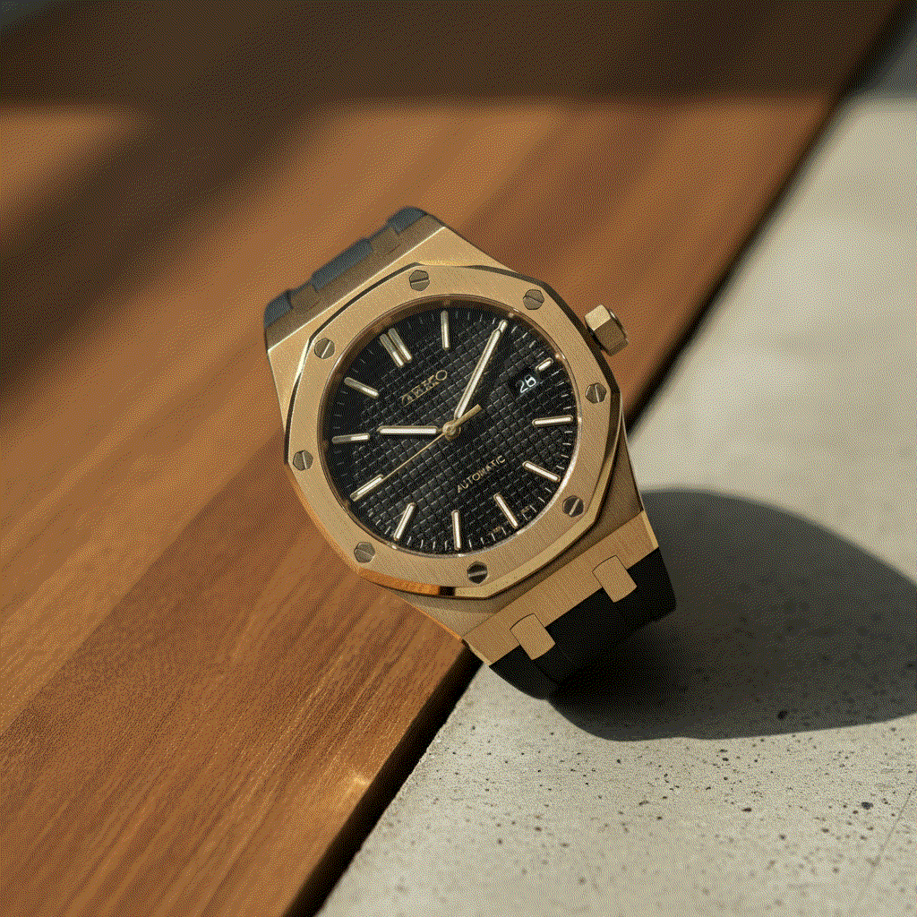 Heritage Oak gold Seiko Mod watch with black dial and stainless steel bracelet