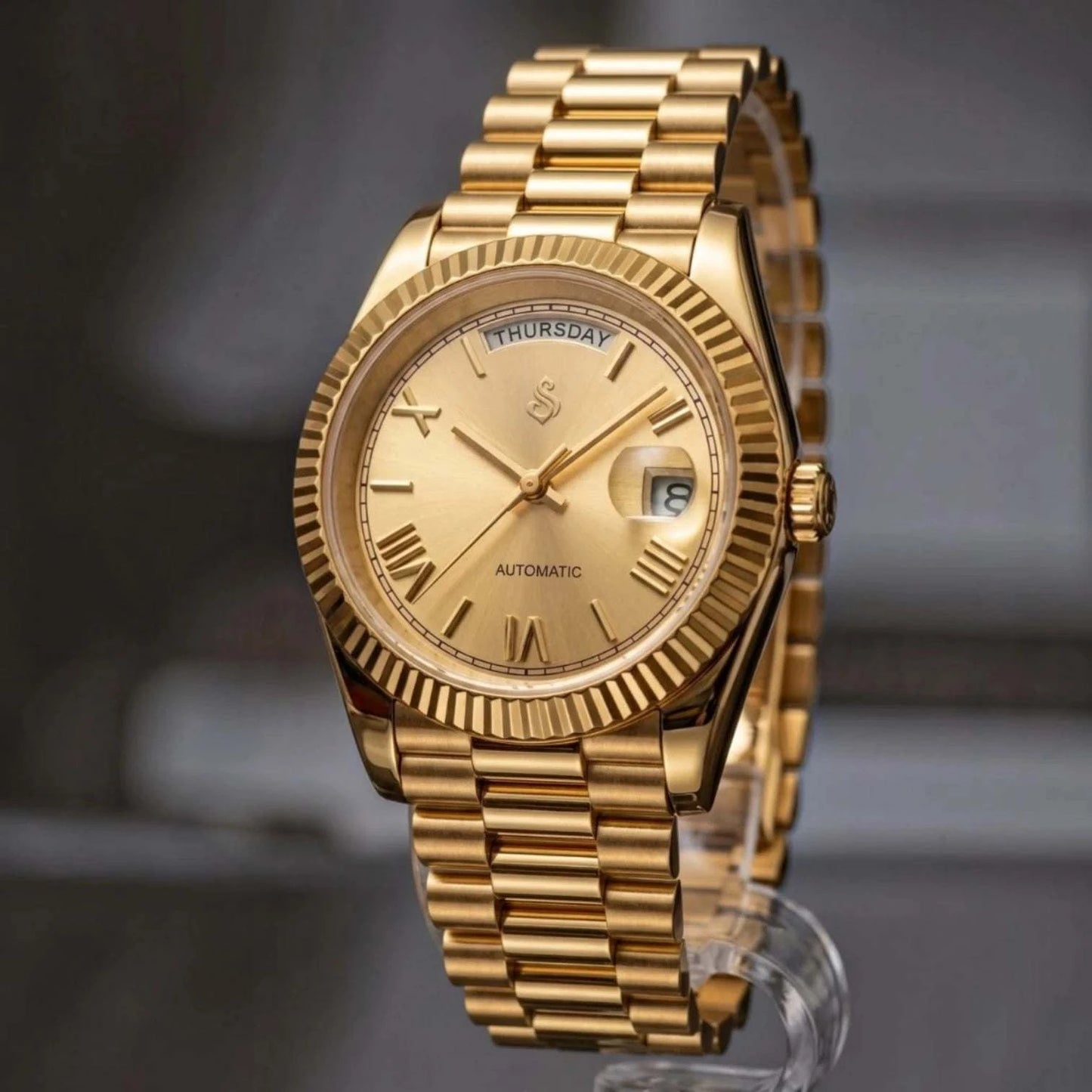 Seiko  Mod Daydate Homage watch with gold Roman numerals, day and date display, and sapphire crystal dial by Modtime Creations 