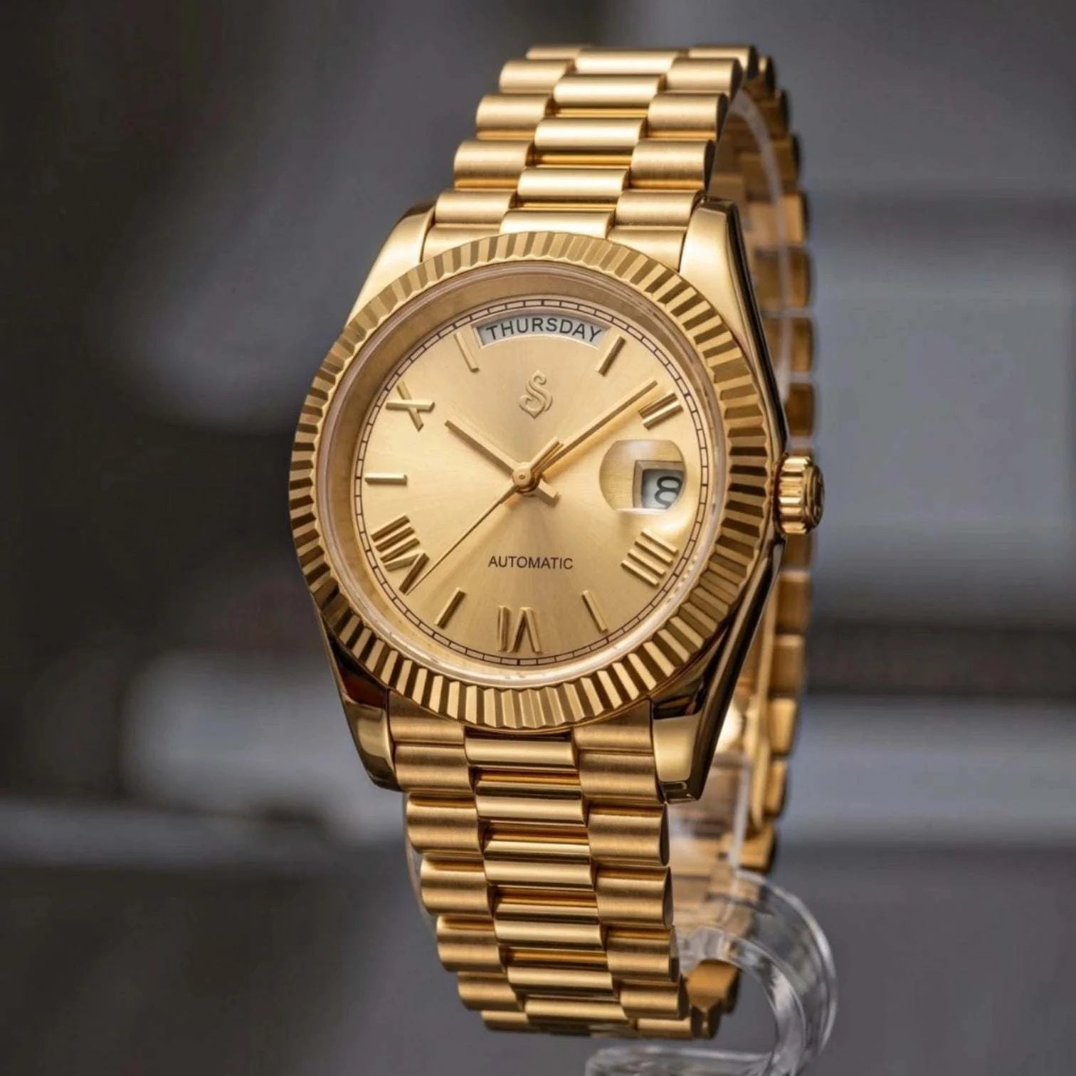 Seiko  Mod Daydate Homage watch with gold Roman numerals, day and date display, and sapphire crystal dial by Modtime Creations 